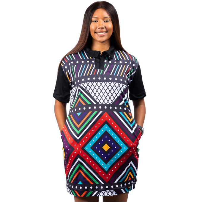 Woman wearing a colorful patterned ndebele golfer dress on a white background